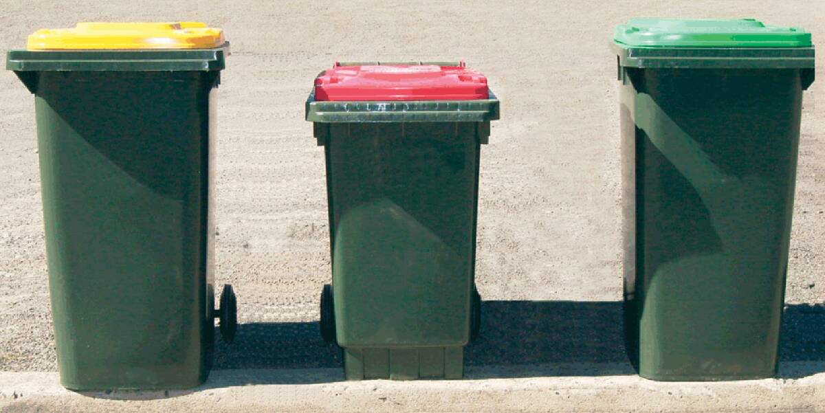 Newcastle council wheelie bins. 240 litre recycling bin (yellow lid), smaller garbage bin (red lid) and 240 litre greenwaste bin (green lid). Photo Supplied. Story Matthew Benns. SHD News. 19 March 2010