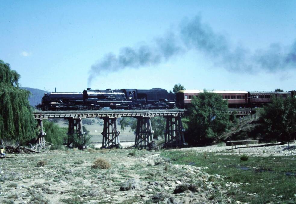 A mid-70s picture of a train crossing the Michelago railway bridge. Photo: Supplied