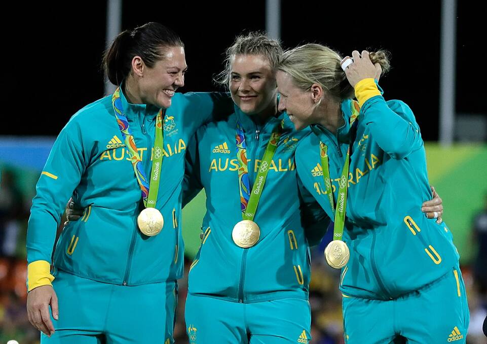 Sharni Williams, left, with her Australian teammates. Photo: Jamie Squire