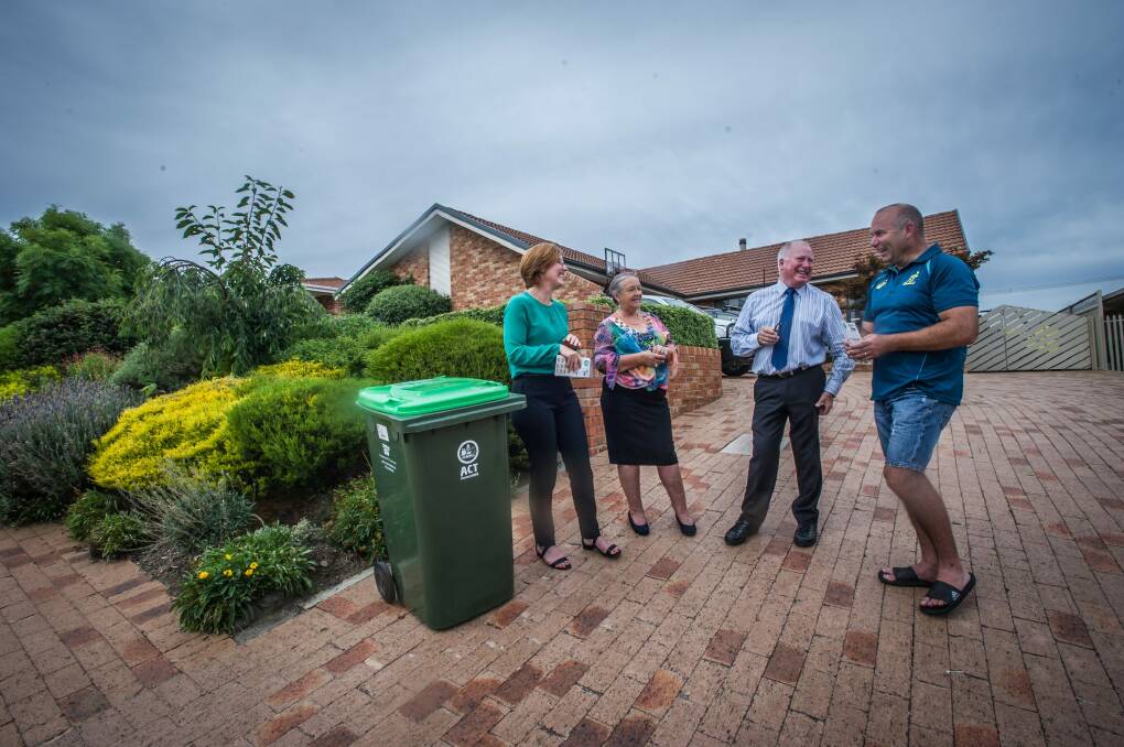Calwell homeowner Stephen McDougall is happy to use one of the first green waste bins delivered to residents in Tuggeranong who have opted in for the service. Photo: karleen minney