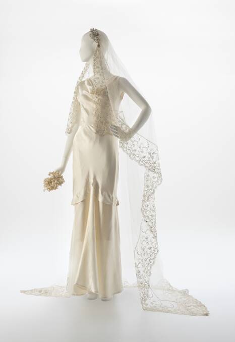 A 1930s silk bridal gown, bias cut with a donated veil. Photo: John Gollings