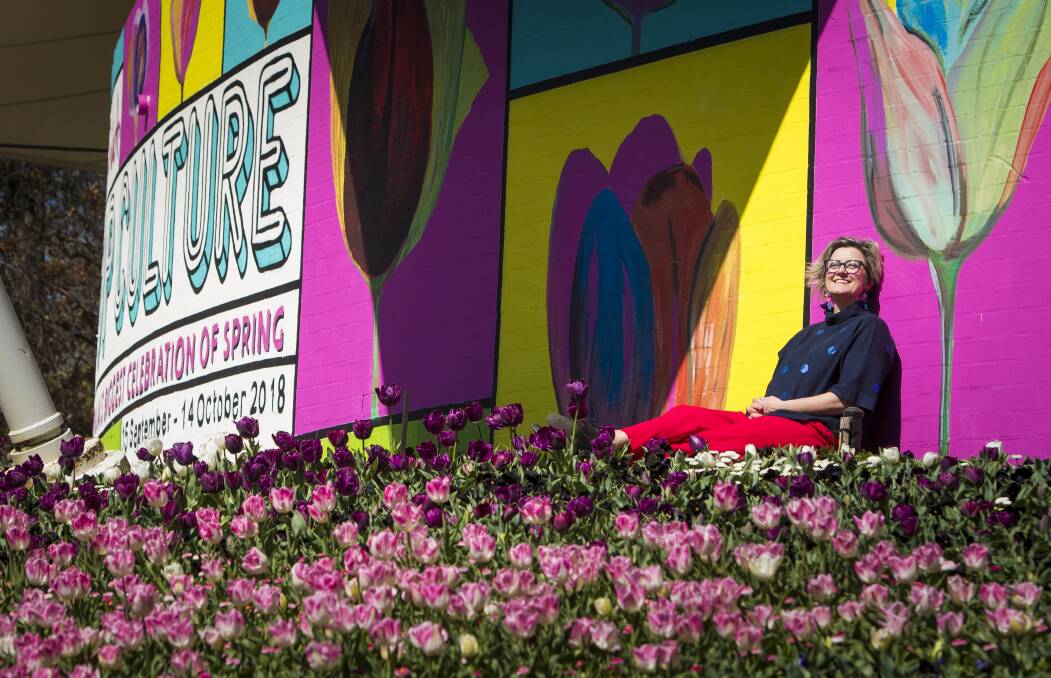 Comedian Chris Ryan, who will be performing at Nightfest, basks in the sunshine on Friday at Floriade, which this year has the theme of pop culture. Photo: Elesa Kurtz
