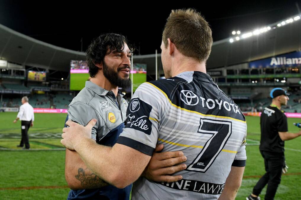 Master and apprentice: Jonathan Thurston congratulates the man who stepped into his massive boots, Michael Morgan, during last year's finals campaign. Photo: AAP