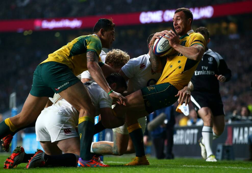 Quade Cooper is smashed in tackle. Photo: Getty Images