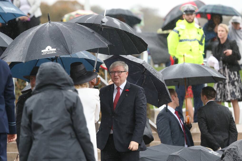 Mr Rudd and Mr Abbott later spotted each other in the crowd. Photo: Andrew Meares