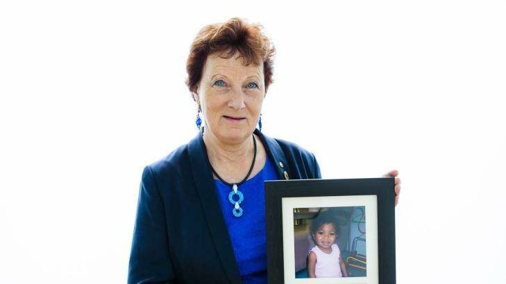 Sandra Mahlberg, ACT Senior Australian of the Year, with a photo of Finova Dos Santos who was brought from Timor Leste for life-saving surgery Photo: Jamila Toderas