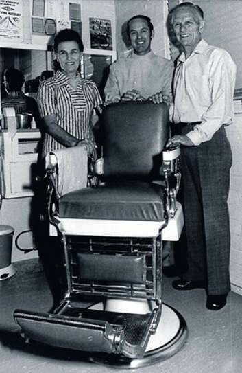 Harold ''Mick'' O'Brien, centre, with the famous barber's chair.