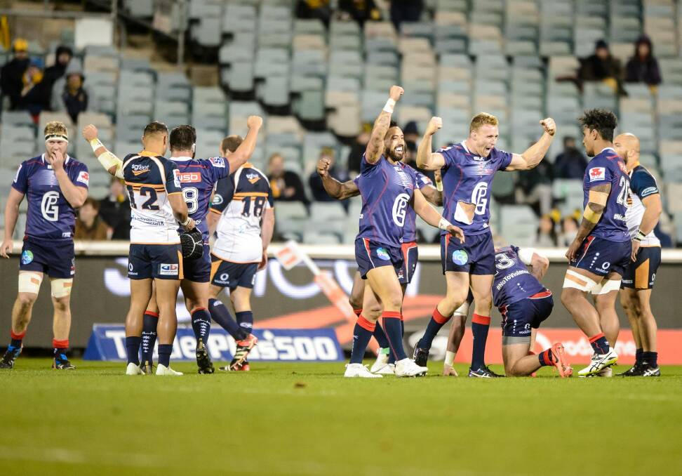 Melbourne Rebels players celebrate a second-half comeback victory over the ACT Brumbies. Photo: Sitthixay Ditthavong