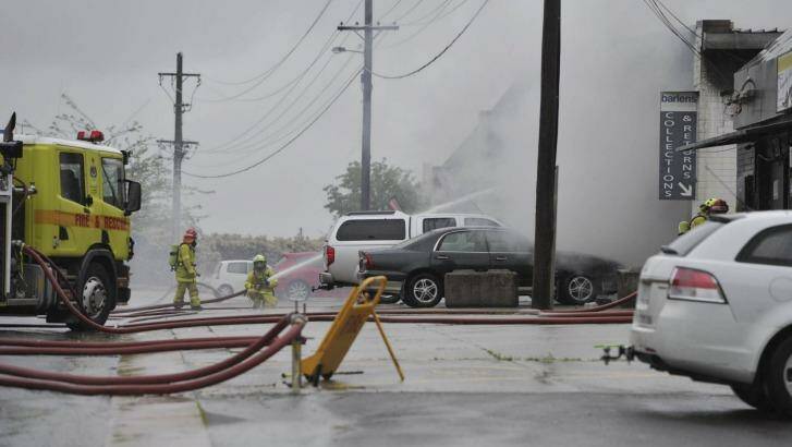 Big task: Firefighters attack the fire, which took nearly six hours to extinguish. Photo: Jay Cronan