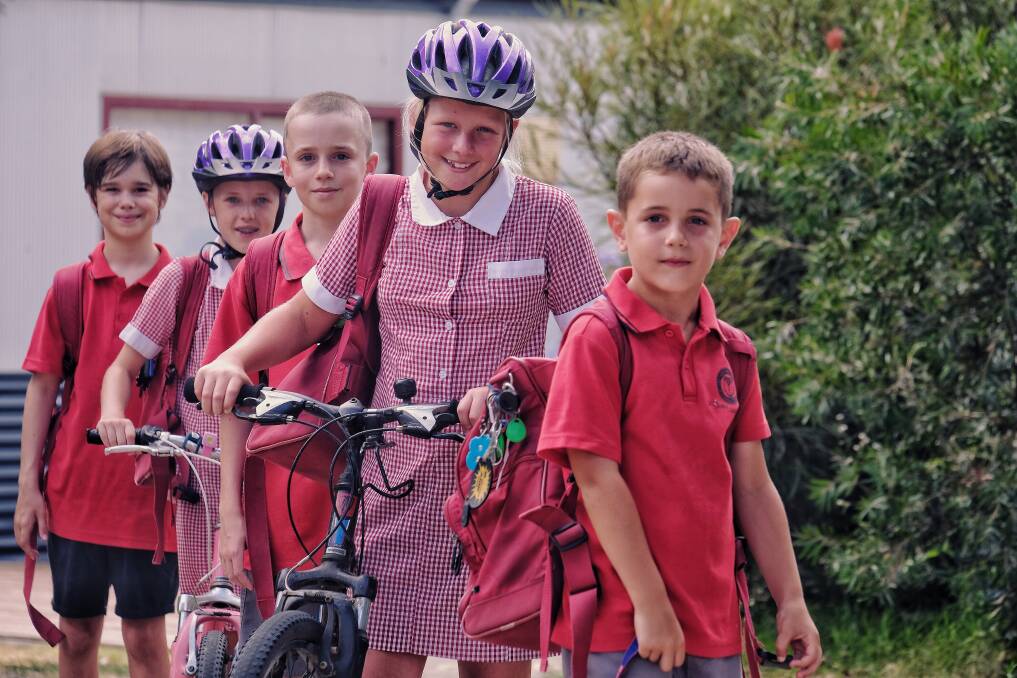 Sam, 7, Claire, 9, David, 11, Chantelle, 10 and Connor, 11, try to walk or ride to school as often as possible. Photo: Luis Enrique Ascui