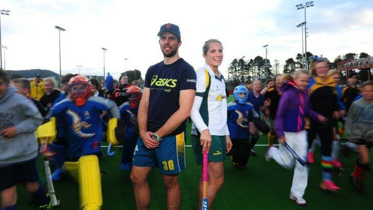 Kookaburras goal keeper Andrew Charter and Hockeyroos player Edwina Bone with kids for a coaching clinic at the National Hockey Centre in Lyneham. Photo: Melissa Adams