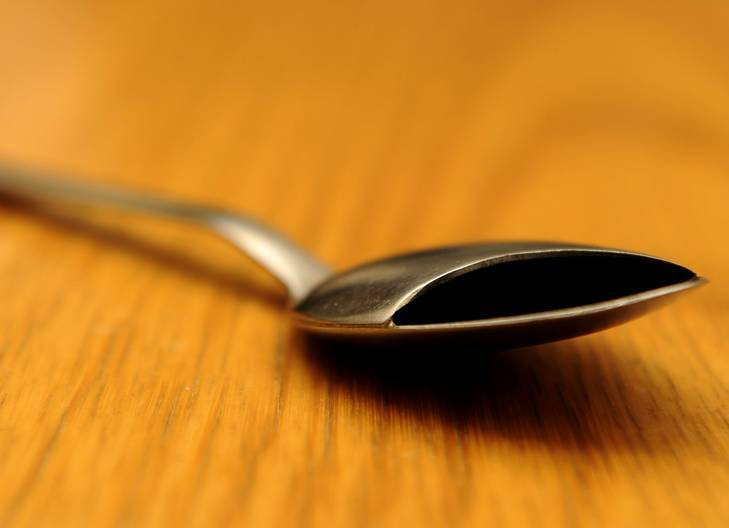 Devices developed by Technical Aid to the Disabled ACT (TADACT). A covered spoon, handy for people with symptoms of Parkinson's disease. Photo: Stuart Walmsley