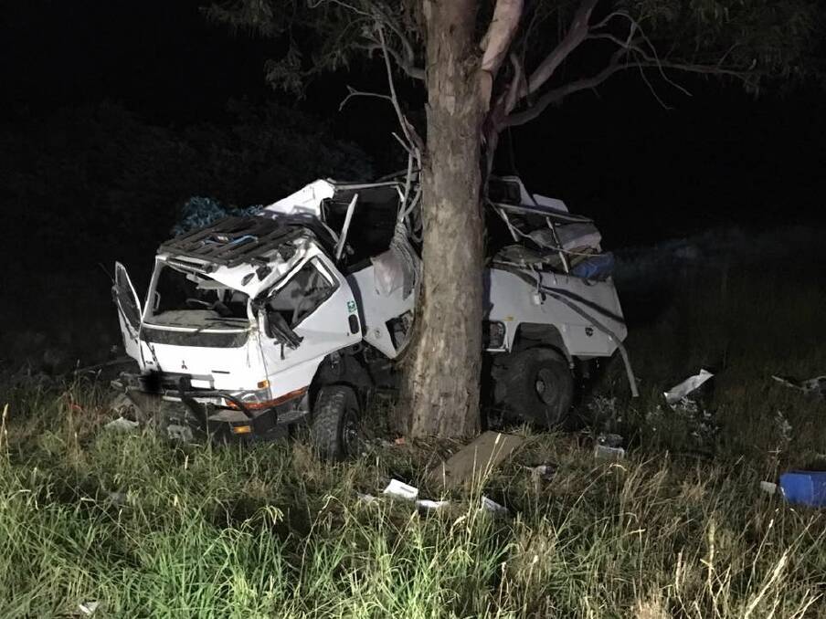 The family's Mitsubishi mobile home hit a tree after allegedly being struck from behind by a B-double at Yarra near Goulburn on Friday night. Photo: NSW Traffic and Highway Patrol Command