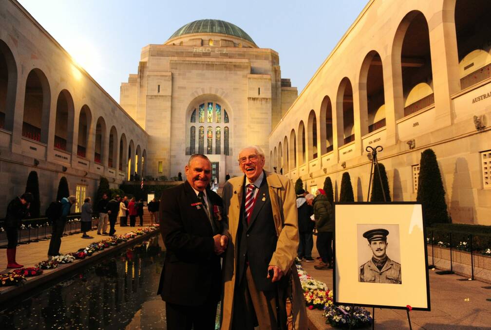 Keith Payne, right, with former ACT RSL president, and World War Two veteran, Ron Metcalfe, of Hughes, at the Australian War Memorial for the Last Post ceremony commemorating the beginning of World War One. Photo: Melissa Adams