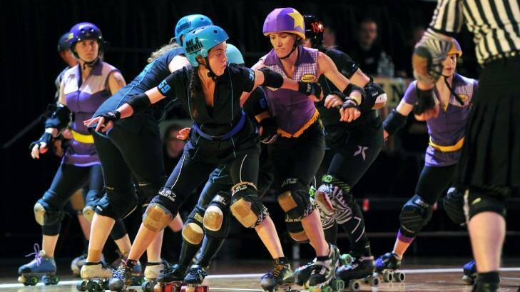 Tense battle: The Canberra Roller Derby League teams will battle it out at their grand final at the AIS Arena. Photo: Graham Tidy