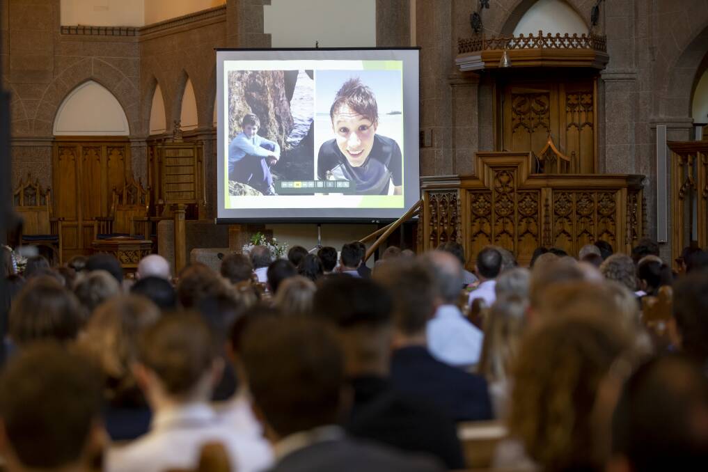 A happy-go-lucky boy: A slideshow of Adriaan Roodt's life is played at his funeral. Photo: Sitthixay Ditthavong