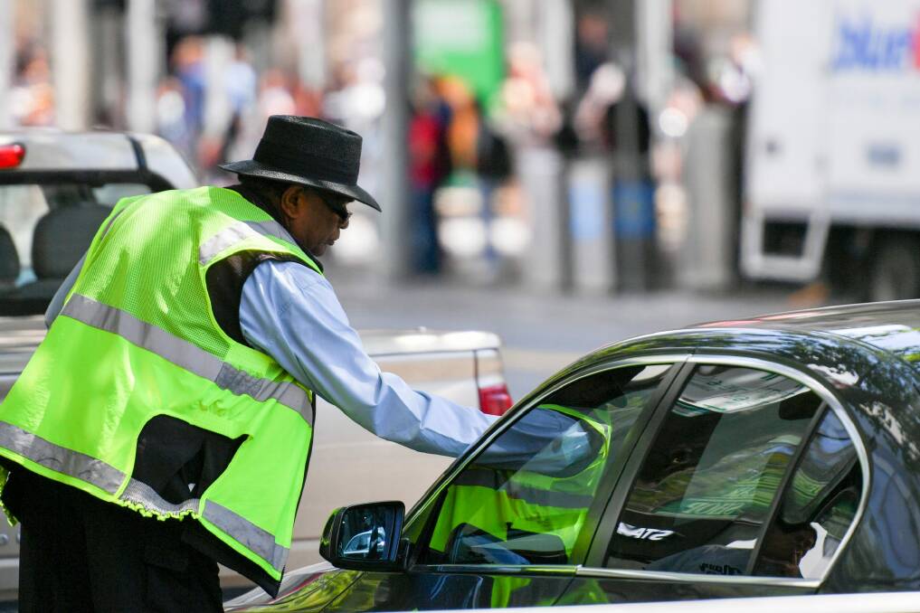 Parramatta parking inspectors' preference for using industrial crayon, rather than chalk, has drawn attention to a legal loophole.   Photo: Eddie Jim