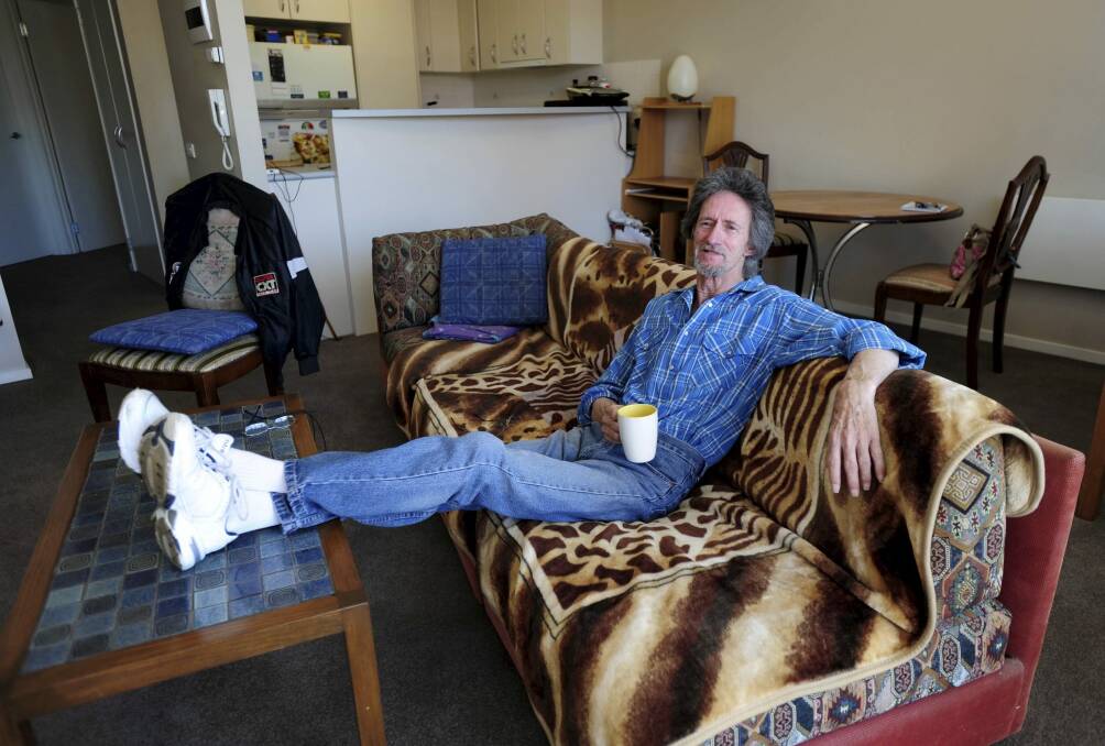 Canberra public housing tenant Peter Marris at his new Braddon apartment. Photo: Graham Tidy