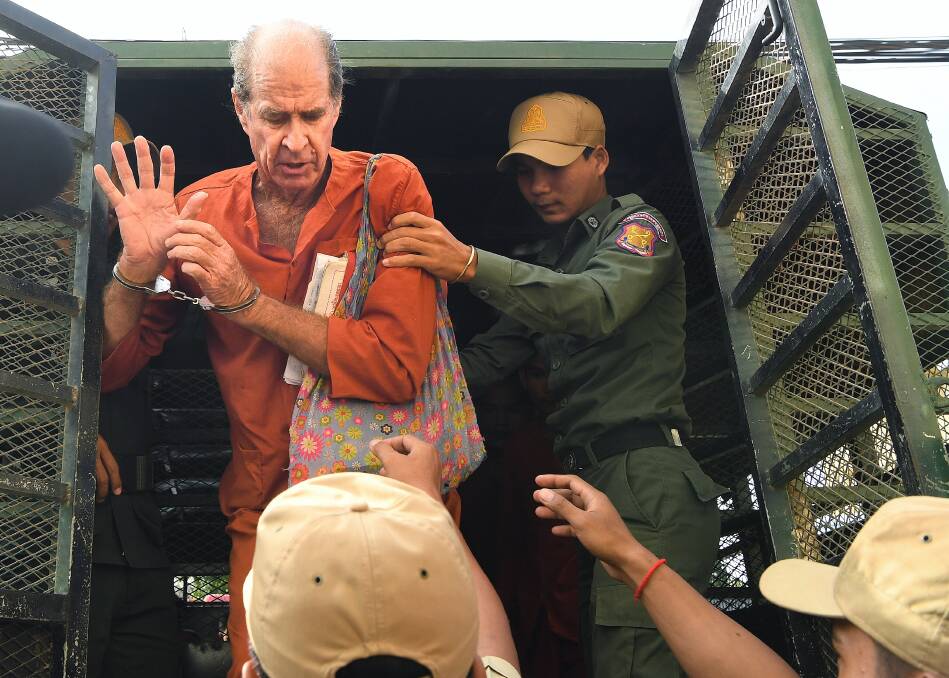 Ricketson, who was accused of espionage, exits the prison van as he arrives at the Phnom Penh Municipal Court  for a court appearance. Photo: Kate Geraghty