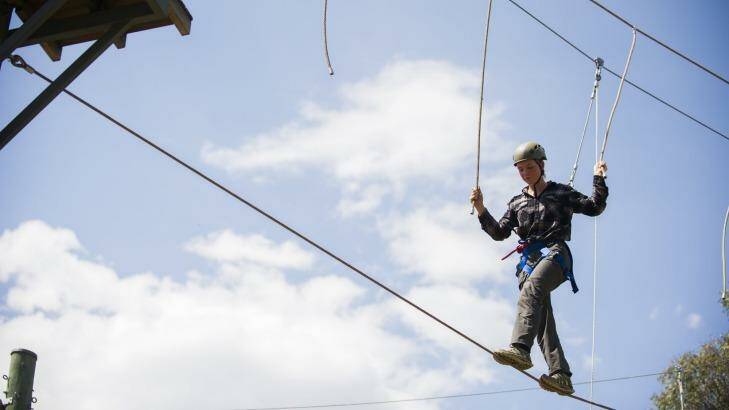 Claire MacDonald of Albury High School on the new high ropes course at Outward Bound in Tharwa. Photo: Rohan Thomson
