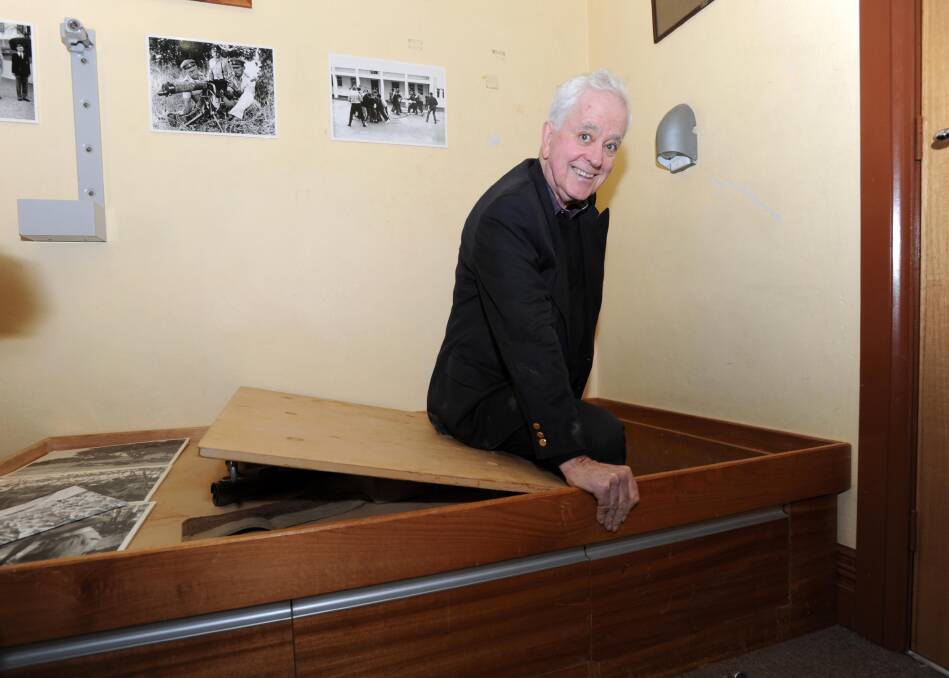 Ross Thomas enters the secret bunker in a Duntroon dormitory that he helped dig as a cadet. Photo: Graham Tidy