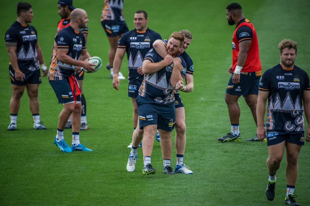 Tom Ross, front, and Tom Cusack are two of seven Canberra players in the Brumbies' side this week. Ross will make his Super Rugby debut as a 20-year-old on Friday night. Photo: Karleen Minney