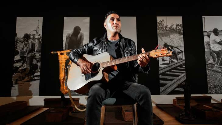 Troy Brady performs original solo guitar songs inspired by stories of Indigenous railway workers at the National Archives. Photo: Katherine Griffiths