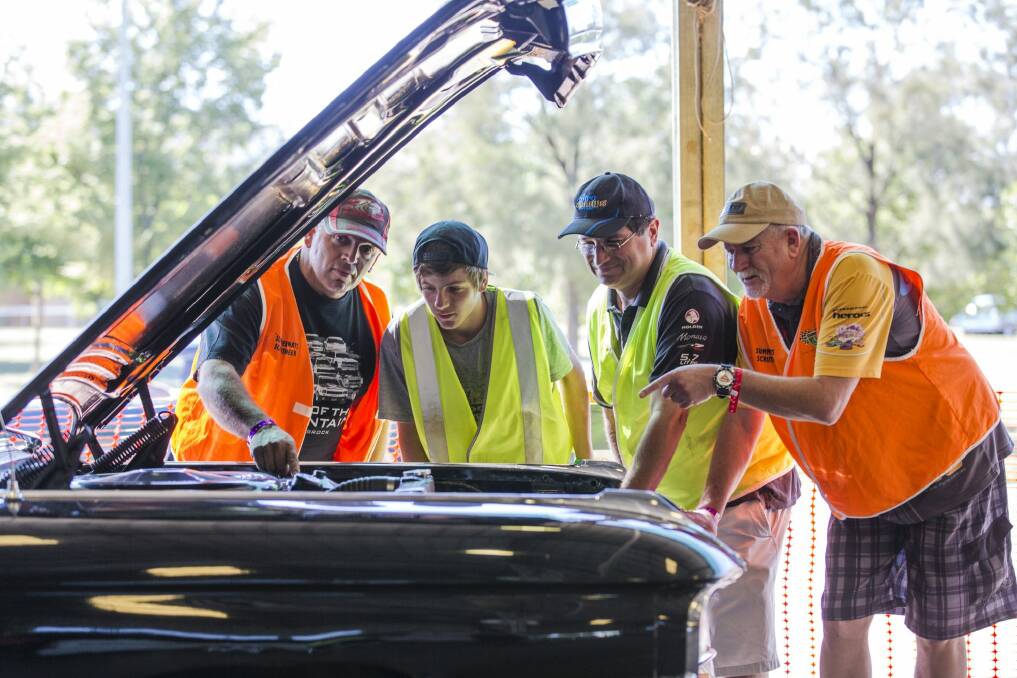 First day of the Summernats  with scrutineers who are all a part of the ACT Street Machine Association checking the Polidano's  59 Cadillac.