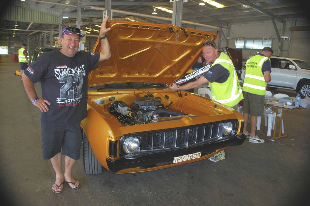 Paul Vezinias with his 1975 VJ Valiant Charger, and Colin Statton, a volunteer scrutineer and member of the ACT Street Machine car club.  Photo: David Ellery 