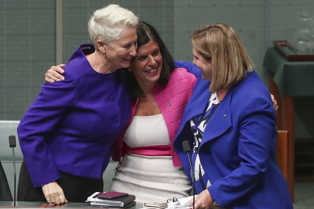 Crossbench MPs Kerryn Phelps, Julia Banks and Rebekha Sharkie celebrate after the Medevac Bill passes the House of Representatives. Photo: Alex Ellinghausen