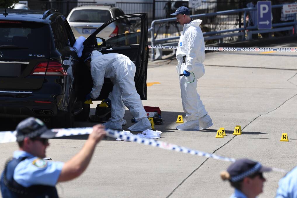 Forensic police at the scene of the shooting.  Photo: Peter  Rae