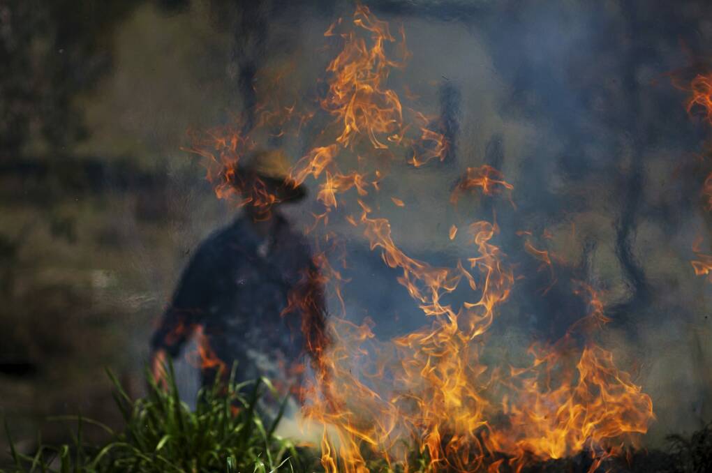 This photo taken by Matt Lindner while doing some hazard reduction burning at his mum's property is one of the entries in The Canberra Times spring photo competition.  Photo: Lauren Gillanders