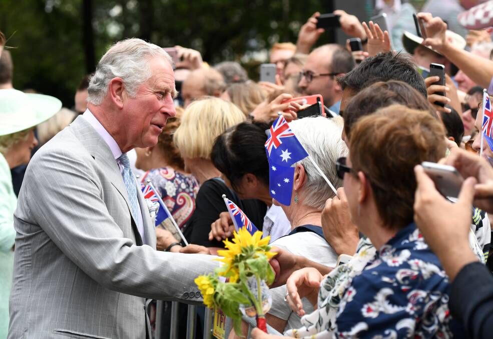 Prince Charles is greeted by members of the public during a visit to Brisbane. Photo: AAP/Dan Peled