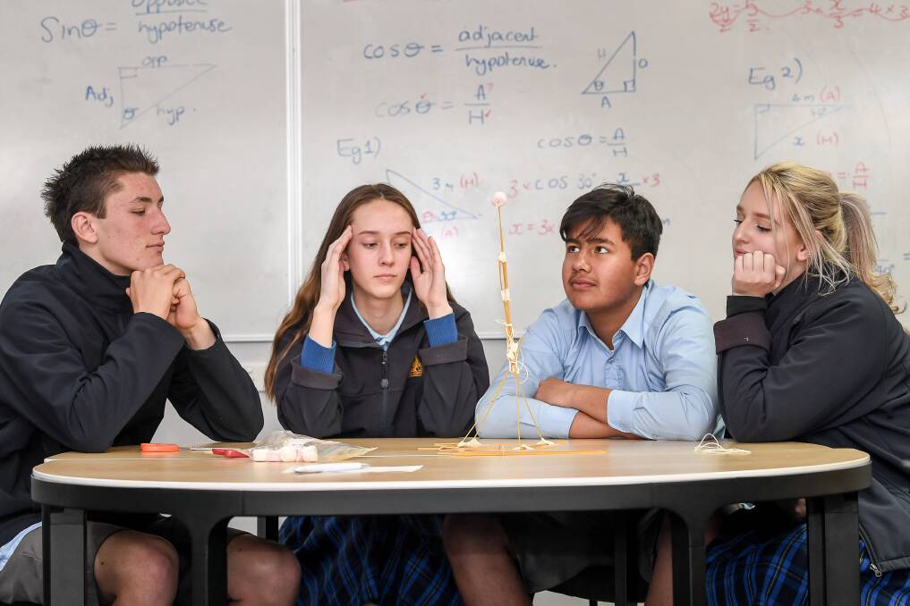 Frankston High School students build a tower with 24 sticks of spaghetti, one metre of tape and string. A marshmallow has to sit on the top. Left to right: Kye Munnikhuis, Keily Blackley, Sam Lutfi and Yasmin Hume. Photo: Justin McManus