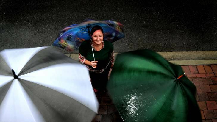 Kate McMahon, 35, of O'Connor was well prepared for the wet weather  in Canberra. Photo: Melissa Adams
