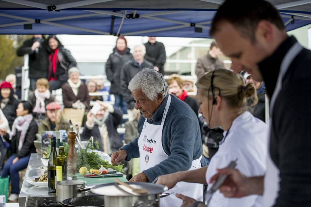 Italian chef Antonio Carluccio makes a star appearance at the Capital Region Farmers Market in Canberra. Treasurer Andrew Barr is in the foreground. 
 Photo: Jay Cronan