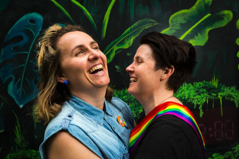 Zoe McDonald and Katie Larsen celebrate the "yes" vote at the State Library in Melbourne.  Photo: Chris Hopkins