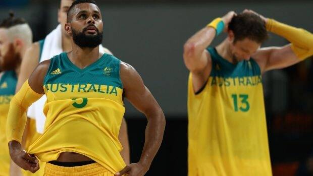 Patty Mills and David Andersen show their disappointment after missing out on an Olympic medal. Photo: Getty Images