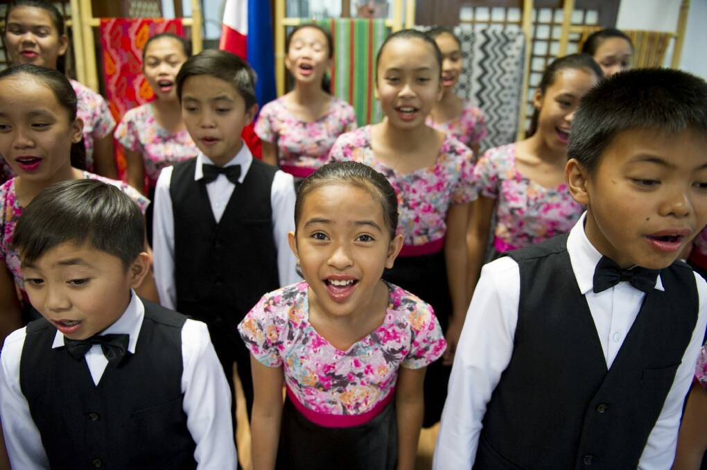 Princess Ara Carmelite De Costo, 10, of Loboc Central Elementary School Children's Choir warms up at the Embassy of the Philippines in preparation for the Bohol Rising Musical.  Photo: Jay Cronan