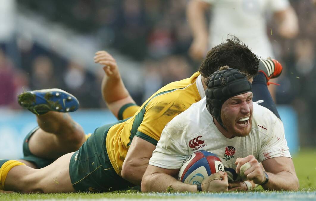 Ben Morgan crashes over for the first try of the game. Photo: AP
