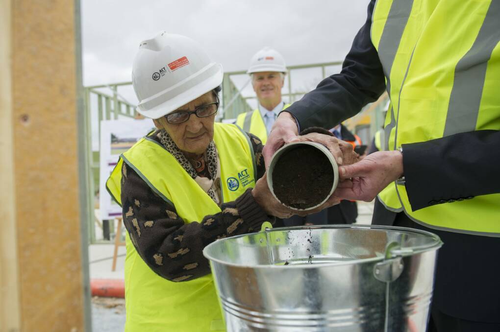 Ngunnawal elder Aunty Agnes Shea lends a hand at the construction of the Ngunnawal Bush Healing Farm, a residential drug and alcohol rehabilitation service for Aboriginal and Torres Strait Islander people.
 Photo: Jay Cronan