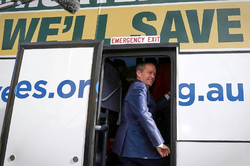 Opposition Leader Bill Shorten boards his campaign bus. Photo: Alex Ellinghausen 