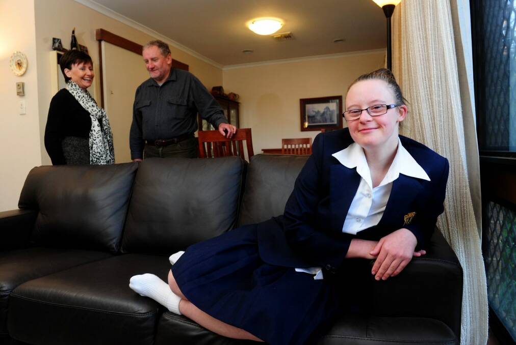 Rhonda and Michael Faragher of Ainslie and their daughter Ruth,18 who has Down Syndrome. Photo: Melissa Adams