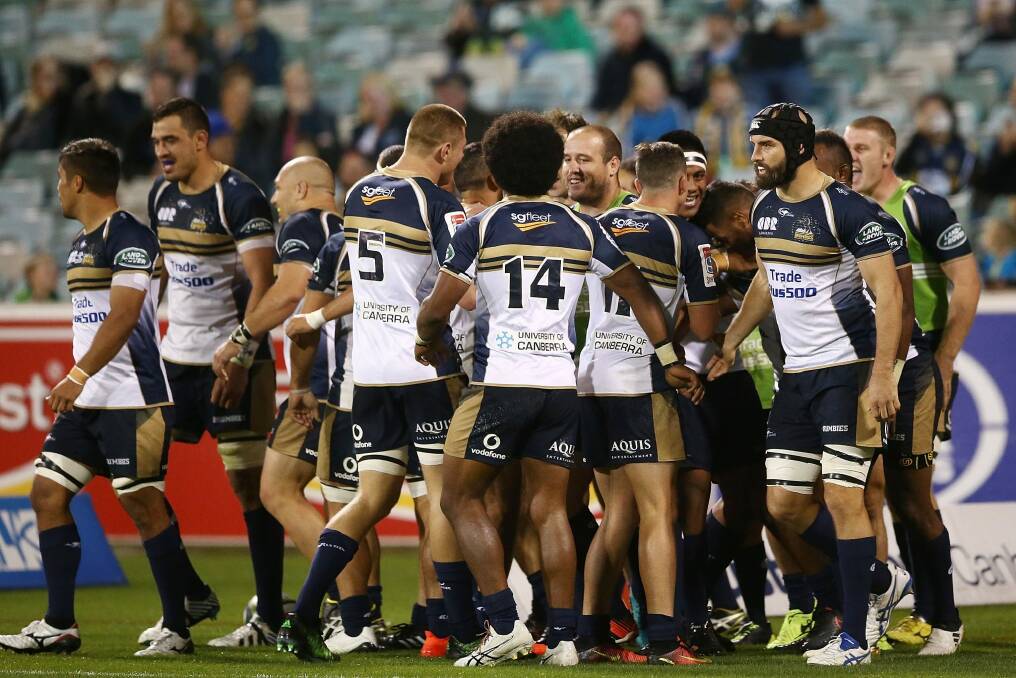 The Brumbies celebrate a try against the Queensland Reds. Photo: Getty Images