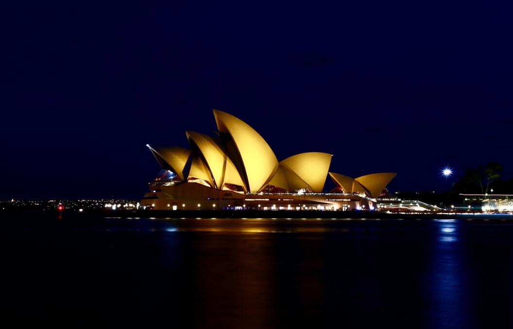 The Sydney Opera House , illuminated in gold for children's cancer research. Photo:  Dean Sewell