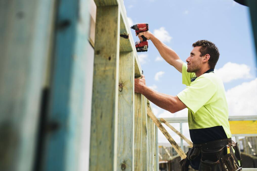 Carpenter Josh O'Connor working on a home in Coombs on Australia Day. 
 Photo: Rohan Thomson