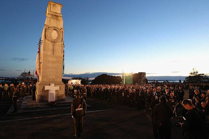 Veterans, dignitaries and members of the public stand around the Cenotaph at the Auckland War Memorial Museum during the ANZAC Day Dawn Service. Photo: Getty