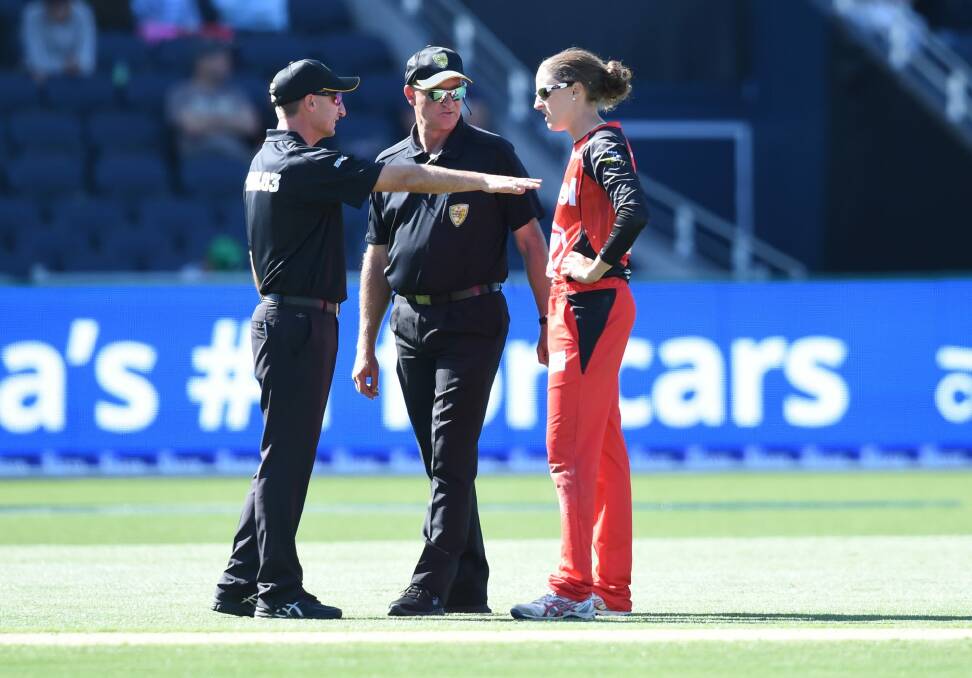 Confusion: Renegades player Amy Satterthwaite talks to umpires after the match had to go to a super over. Photo: AAP