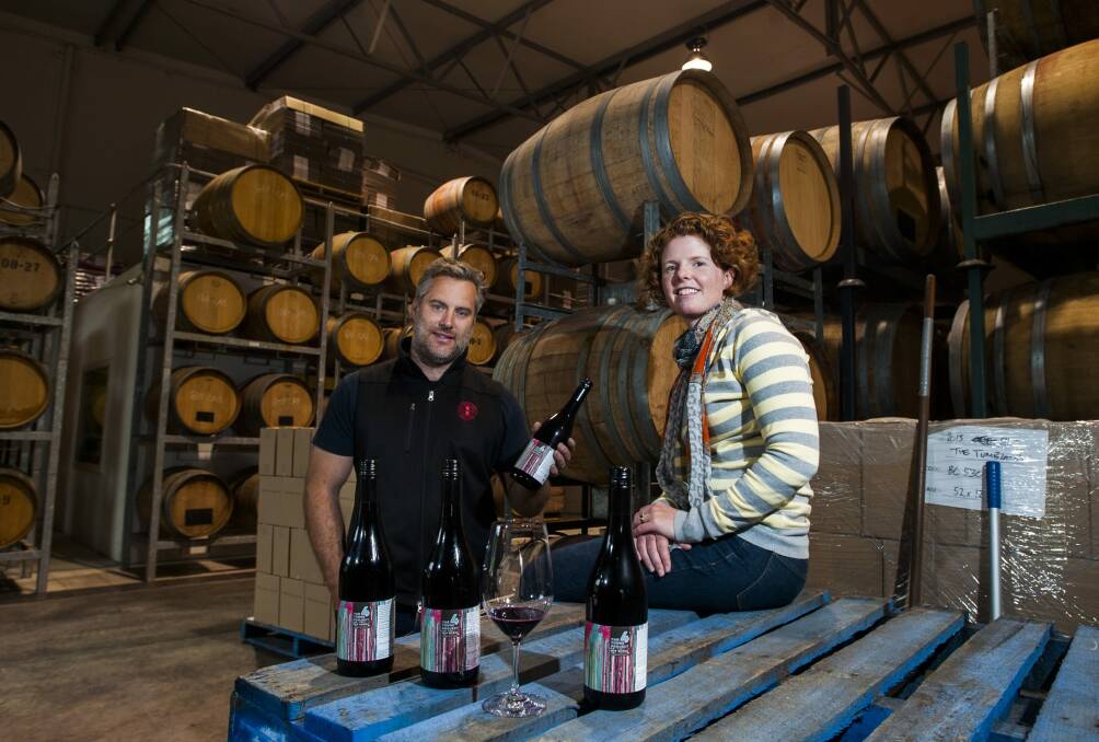 Eden Road Wines wine maker Nick Spencer and Four Winds Vineyard business manager Sarah Collingwood with some of the first 4-Tonne Project bottles.  Photo: Elesa Kurtz