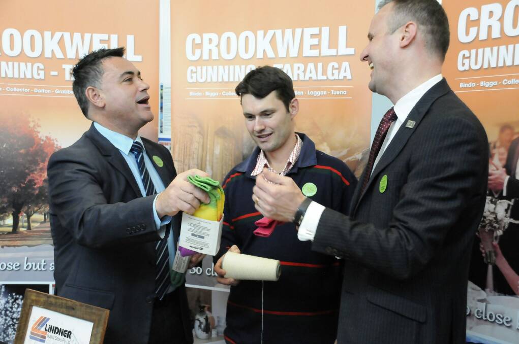 Member for Monaro John Barilaro and ACT Chief Minister Andrew Barr, along with Crookwell sock manufacturer Andrew Lindner, launch the Canberra Region network in Queanbeyan. Photo: Kimberley Granger